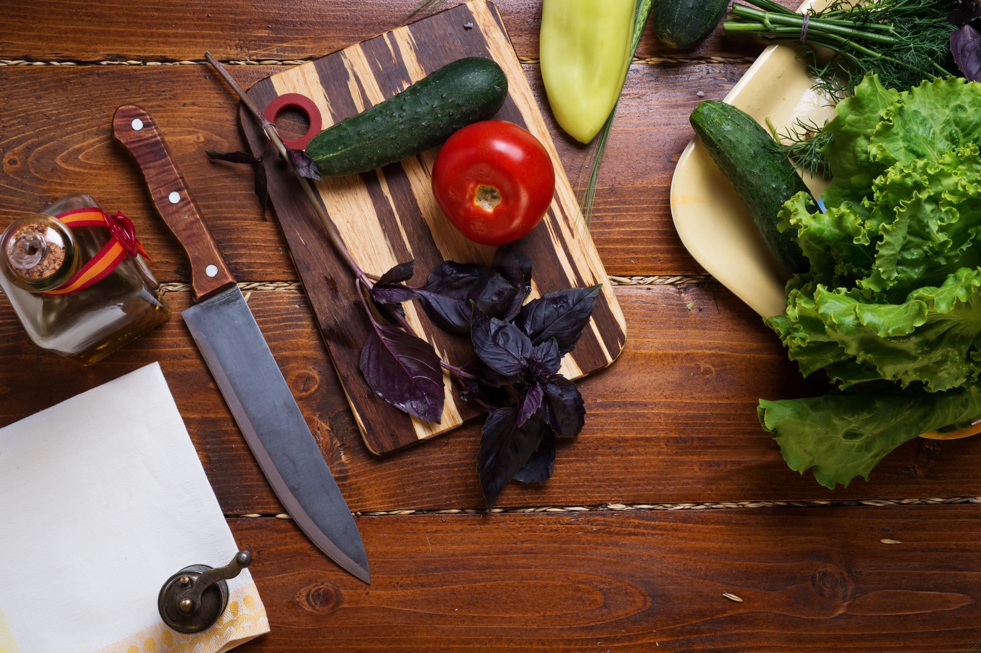 Workshop table with vegetables and knives